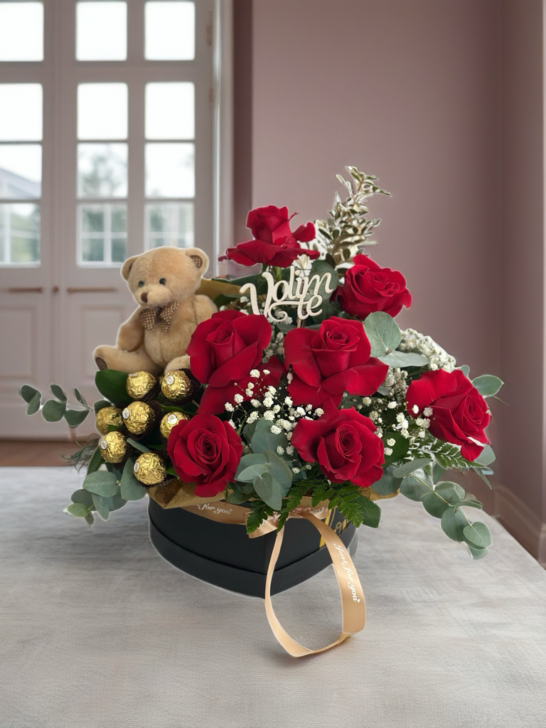 Arrangement with red roses and chocolates